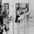 class stretching at bar bw